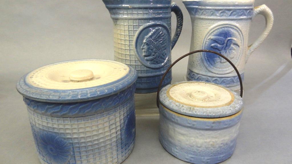 Blue & White Stoneware Crocks & Pitchers: Four antique pieces of blue and white glazed stoneware, small crock with bale handle has lid with swastikas on lid knob and rim 6"D, 3.75"H, medium crock with flower on trellis design 7.5"D, 5.75"H, p