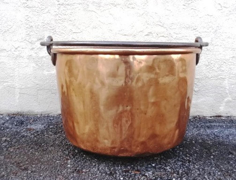 Large Copper Apple Butter Kettle: Antique large apple butter kettle, copper body with rolled top rim and dovetailed bottom, thick wrought iron bale handle, 23"D, 15.5"H to rim, 28.5"H to top of handle