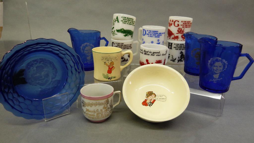 Shirley Temple Blue Glass, Orphan Annie & Alphabet Mugs: Four pieces of Shirley Temple blue glass circa 1930's, three pitchers 4.5"H, bowl 6.5"D, six milk glass child's alphabet mugs 3"H, antique "Merry Christmas" mug signed Bavaria, Orphan Annie and Sandy 