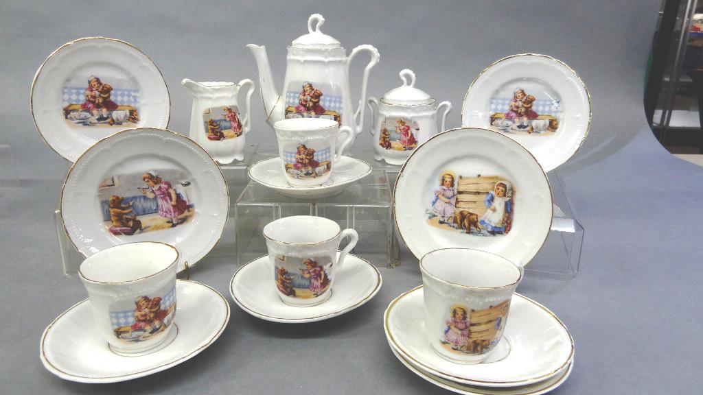 Antique Child's Teddy Bear Tea Set: Early 20th century unmarked child's china tea set with assorted scenes of a young girl with a Teddy Bear, Teapot 6"H, sugar, creamer, four cups, five saucers and four plates