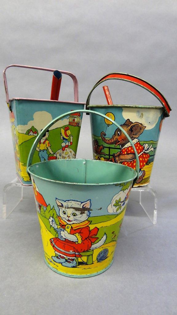 Three vintage Chein Tin Sand Pails: Three vintage Chein litho tin colorful tin sand pails, pail with kittens, pail with animals on the boardwalk and pail with Humpty Dumpty and other characters, 3.5" to 4.5"H to rim, includes two shovel
