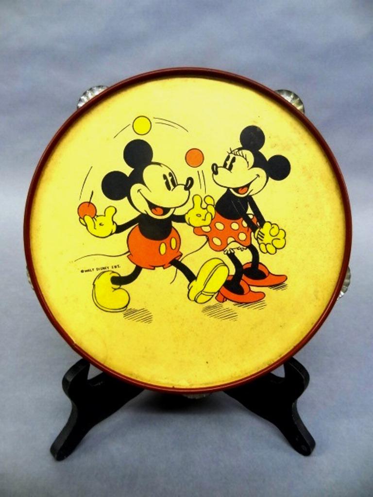1930's Mickey Mouse Tambourine: Scarce 1930's Walt Disney Ent. Toy tambourine, red metal frame with cardboard head depicting Mickey juggling as Minnie watches 10"D