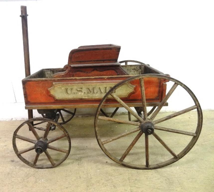 Antique Child's U.S. Mail Wagon: Large antique child's pull wagon, painted wood body has a seat which slides forwards and backwards, folksy painted leaping horse on front, painted wood plaques on both sides "U.S. MAIL", pin striping 