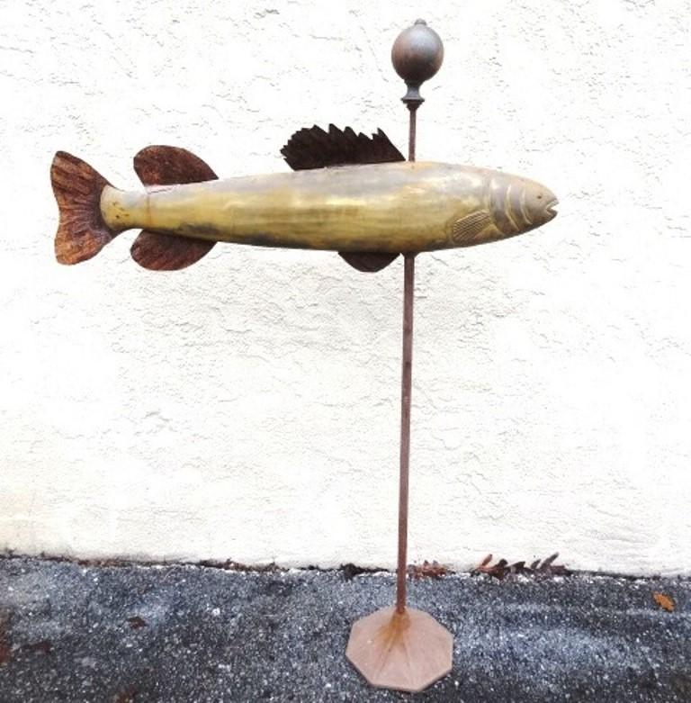 Vintage Carved Fish Weathervane: Carved wood fish weathervane, wood body has a nicely carved face with open mouth and brass tack eyes, carved gills, nail decoration along the length of the body, crimped tin fins and tails, mounted on