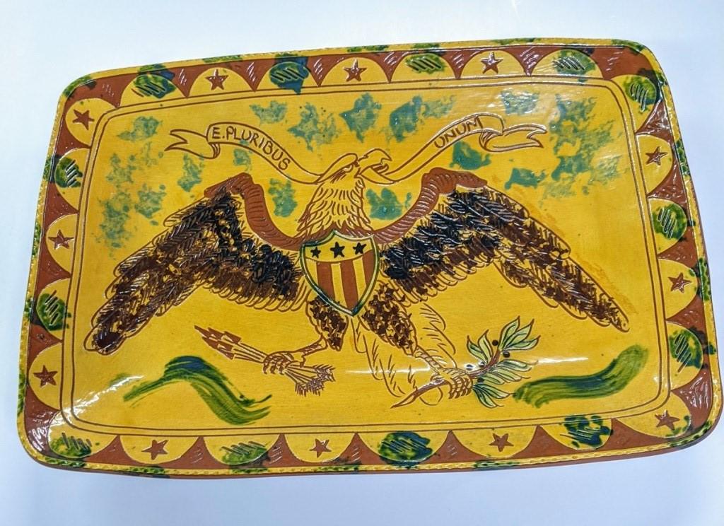 Large Lester Breininger Redware Eagle Tray: Lester Breininger redware tray featuring a spread wing eagle with shield clutching arrow with banner "E. Pluribus Unum", dated 1995, slip, sgraffito and sponge decoration, 13.5" by 19.5" by 2"H