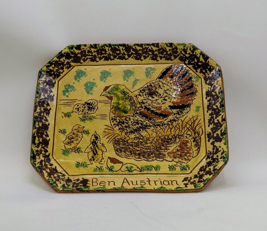 Breininger "Ben Austrian" Chicken Tray: Lester Breininger redware tray playing tribute to Berks County Pa. artist Ben Austrian, depicting hen on nest with four chicks and a broken egg, dated 2005, slip, sgraffito and sponge decoration, 9.75