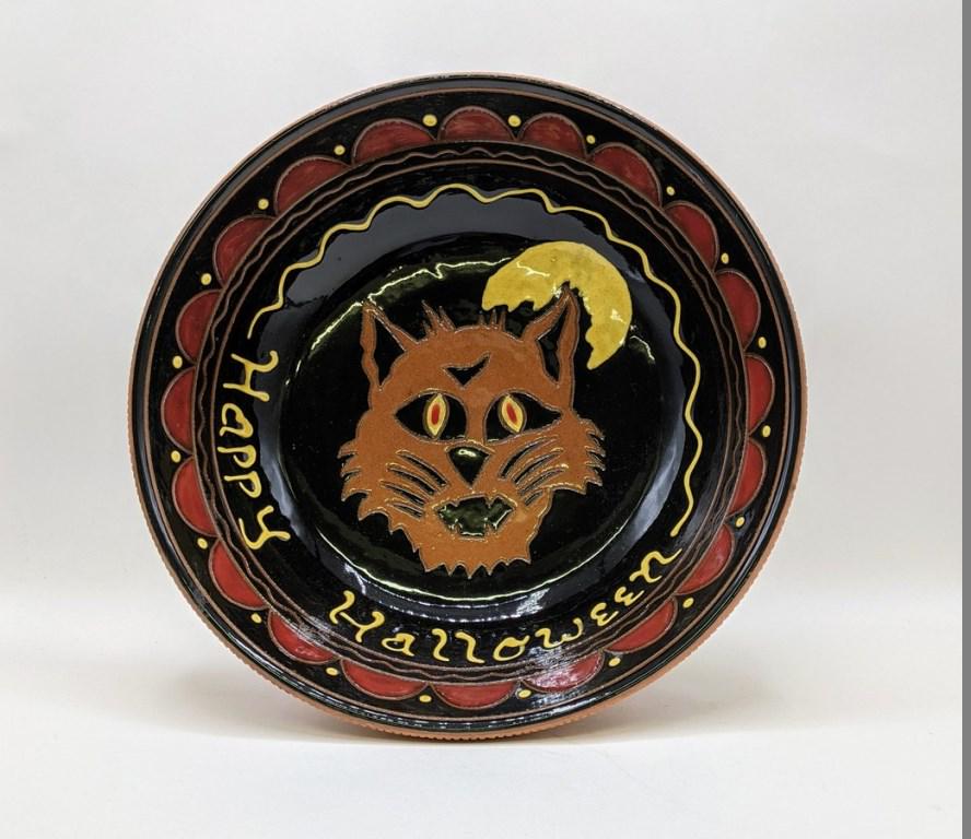 Breininger Halloween Candy Bowl: Lester Breininger redware bowl featuring a not too scary wolf and a full moon, slip and sgraffito decoration, dated 2008, 10.5"D, 2.75"H