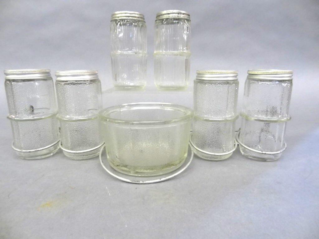 Vintage Hoosier Spice Jars & Hanging Rack: Vintage silver painted hanging wire rack holding a set of four matching spice jars and a mixing bowl, 14"W, also includes a extra pair of salt and pepper shakers with dented lids