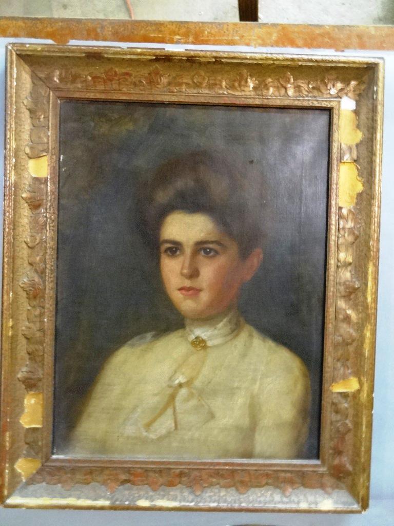 Antique Young Lady's Portrait: Early 20th century oil on canvas portrait of a young woman mounted on a 16" by 21" stretcher, housed in a period gesso over wood frame
