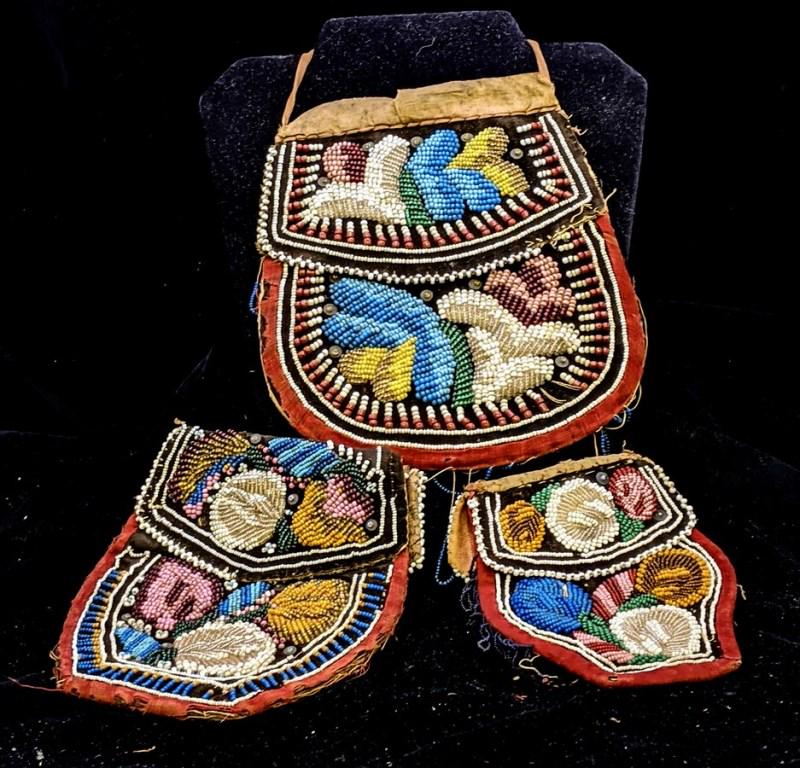 Three Antique Native-American Beaded Purses: Large beaded purse has scattered bead loss, wear to edges and missing lots of beaded fringe 6.5" by 7.5", medium bead purse with old Christie's Auction label has scattered minor bead loss and wear to