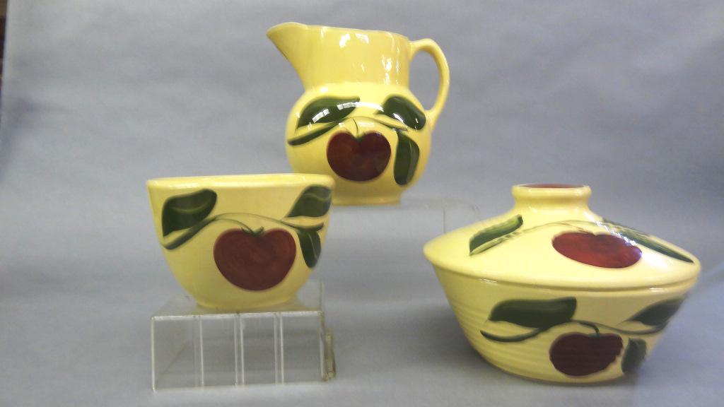 Watts Oven Ware Apple Pitcher & Bowls: Vintage Watts Oven Ware pitcher with ice spout decorated in the apple with three leaves pattern 8"H, #601 flat bowl with lid 9"D, unnumbered bowl 6"D, 4"H