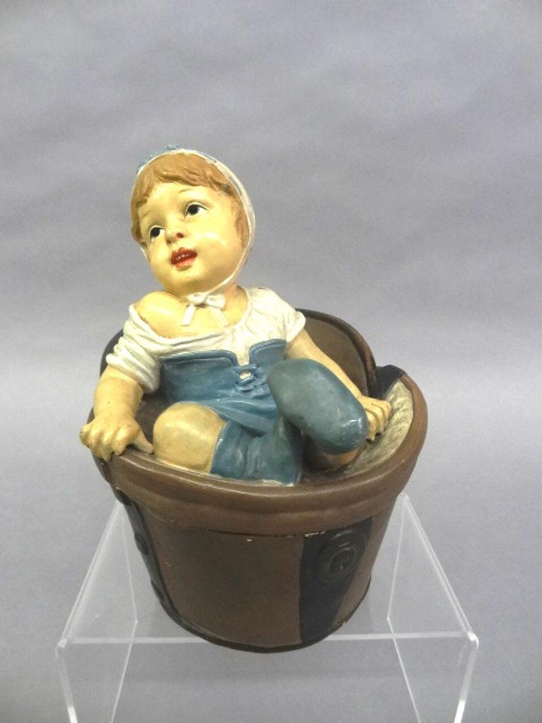 Antique Figural Girl On Hatbox Tobacco Jar: Antique French or German ceramic tobacco jar, figural young girl falling through the lid of a hatbox, 6"W, 7.5"H, incised DEP 320 and other illegible marks