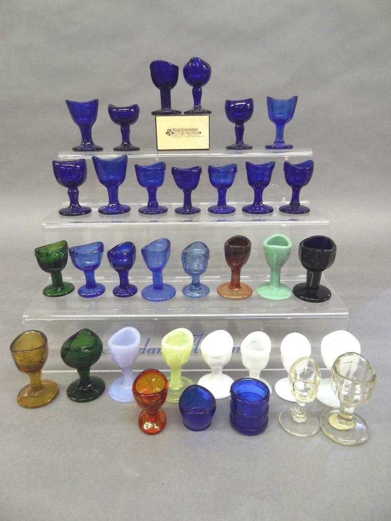 35 Vintage Colored Glass Eye Cups: Nice assortment of 35 vintage glass eye bath cups from various manufactures in assorted colors, average size 2.5"H