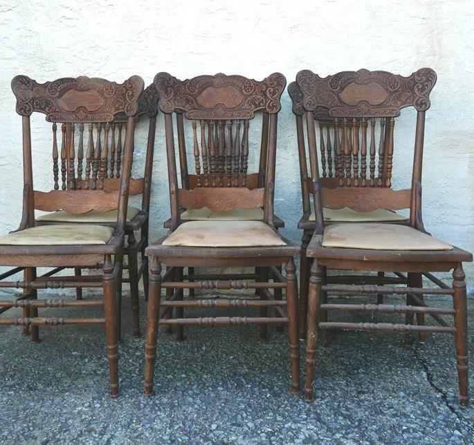 Set of 6 Pressed Back Dining Room Chairs: Set of six antique oak fancy pressed back dining room chairs with older vinyl upholstered seats, 41"H