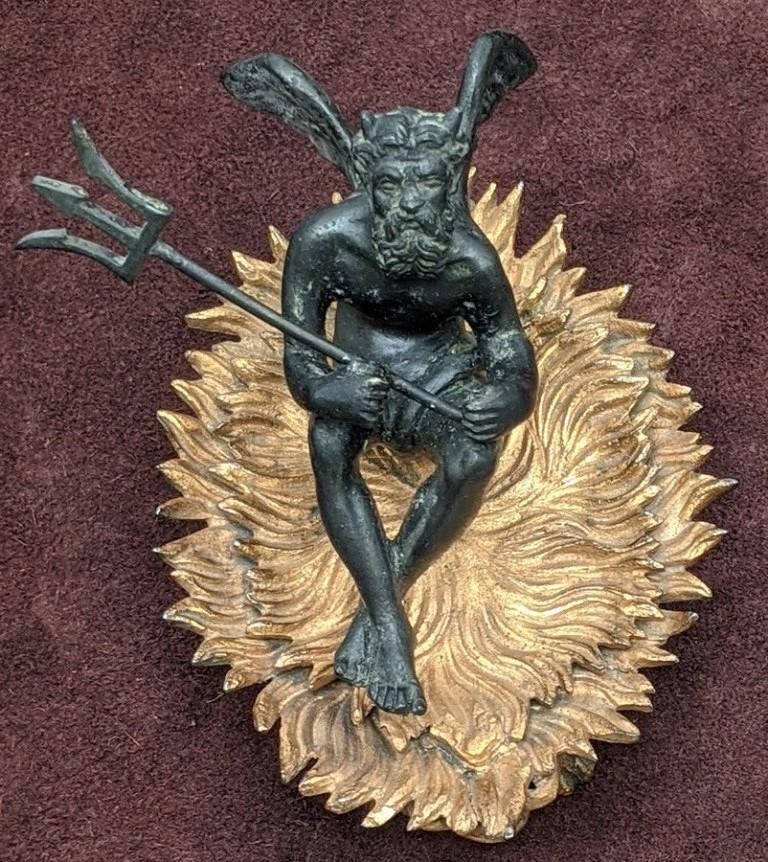 Small Devil Figure: Vintage patinated devil with wings, tail, horns and a trident sitting on brass flames, pair of grotesque figures used for legs, 5"L, 3.5"W, 4"H