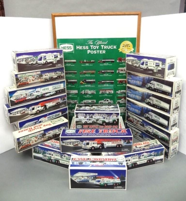 22 Hess Trucks & Poster: Twenty-two Hess trucks in original boxes from various years, 1964 - 2000 Hess truck poster