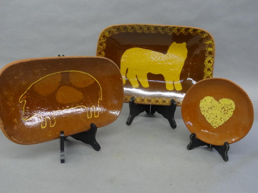 Foltz Pottery Pig & Cat Decorated Tray: Foltz Pottery redware cat tray has toggle decorated rim, slip decorated cat and sponge decoration around rim 15.75"W, 10.5"D, 1.5"H, redware pig tray has toggle decorated rim and pig outline in slip d