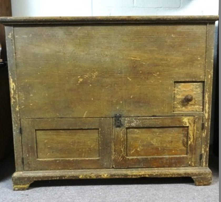 Antique Pa. Primitive Mule Chest: Early 1800's tulip poplar mule chest with remnants of original finish, top with iron hinges and bread board ends covers divided well, front has a single small drawer over two paneled doors, paneled si