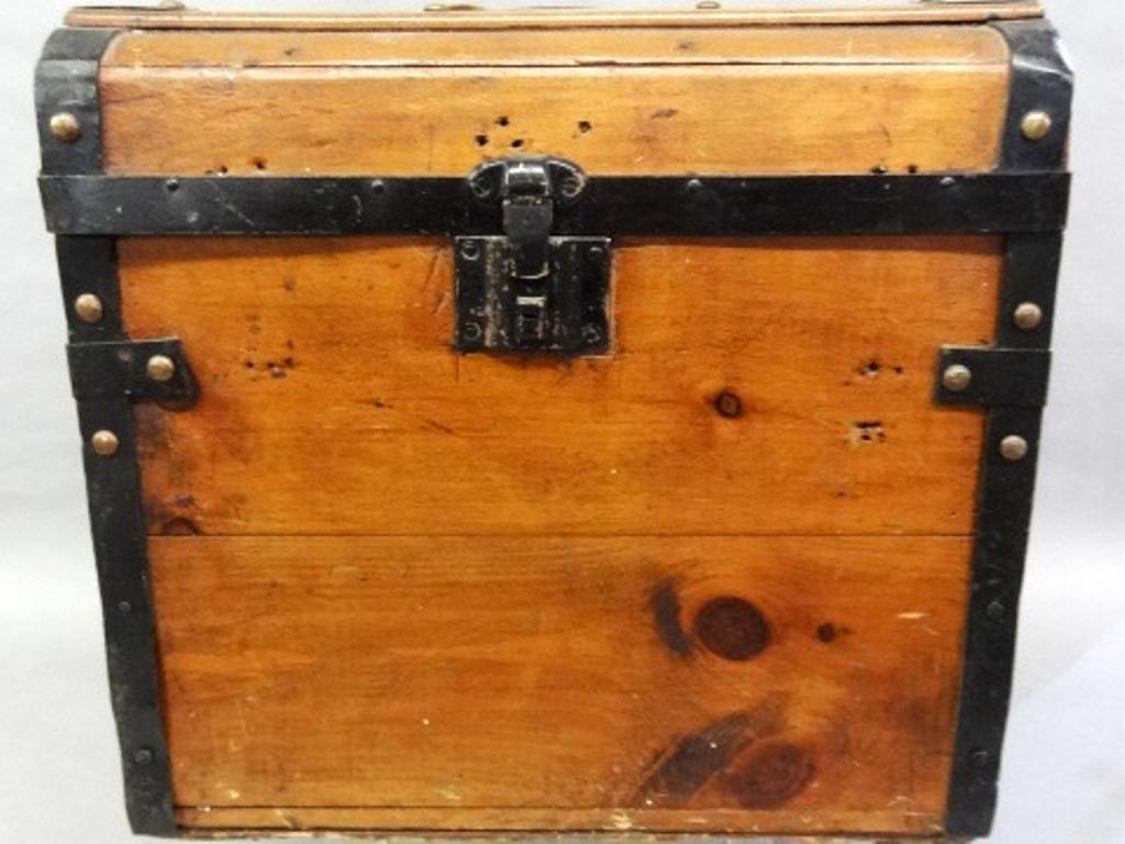 Antique Lady's Small Traveling Trunk: Antique late 1800's - early 1900's lady traveling truck, pine with black painted metal banding and brass tack decoration, floral paper lined interior, leather handles on top and sides, 18"W, 17"H, 15"
