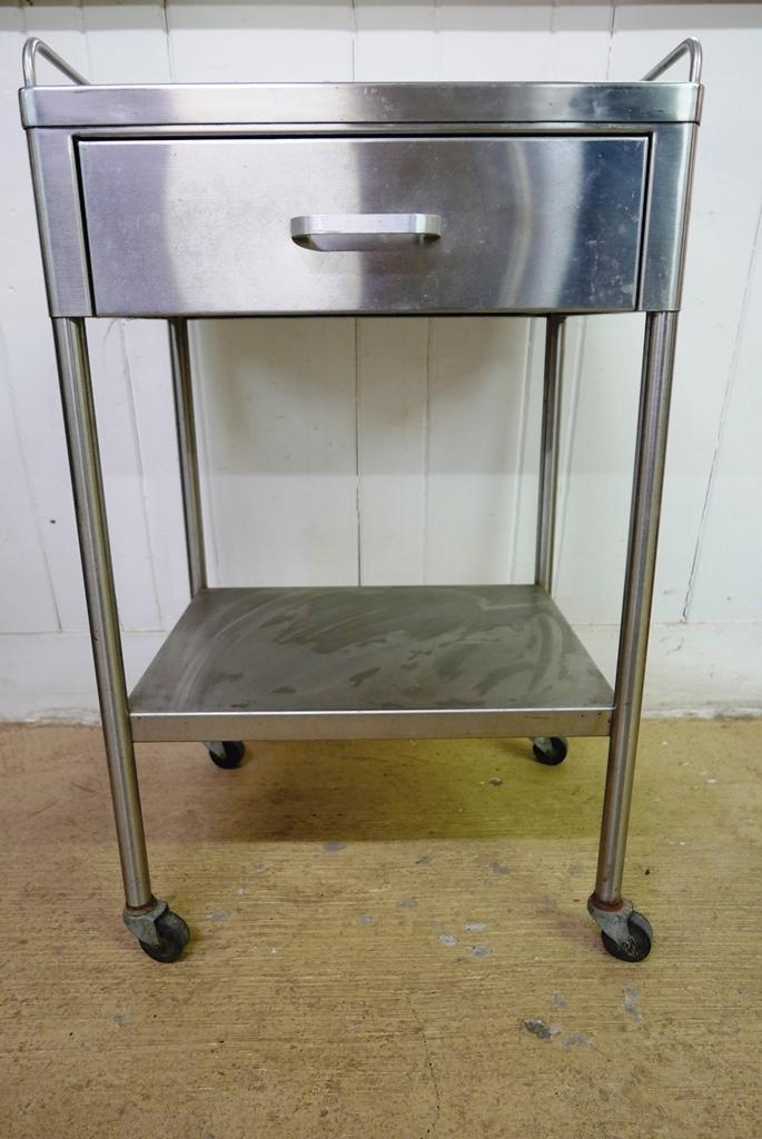 Stainless Steel Rolling Utility Cart: Vintage stainless steel utility cart on casters has a gallery over a single drawer and a bottom shelf, 21.5"W, 33"H, 16.5"D