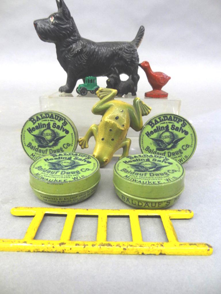 Small Advertising Items & Toys: Four antique lithographed tins advertising Baldauf's Healing salve 1.75"D, Red Wing Shoes small goose 1.75"L, carved wood Scotty Dog, Irwin celluloid Scotty dog 4.25"L, plastic frog 2.75"L with dent, 