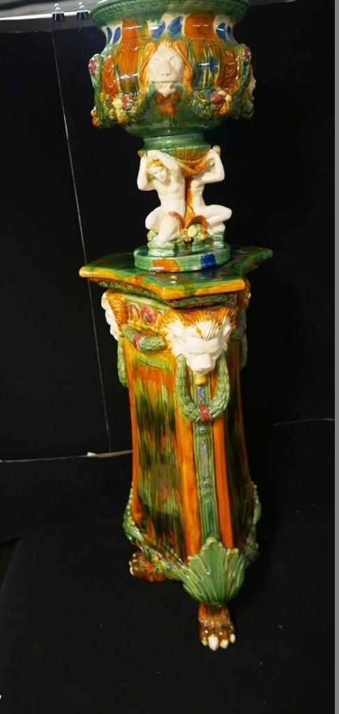 Minton Style Majolica Jardiniere On Stand: Very impressive jardiniere on stand, jardiniere 21"H features three lion's heads connected with swags of fruit over three partially draped male nudes connected with cornucopias, triangular base has th