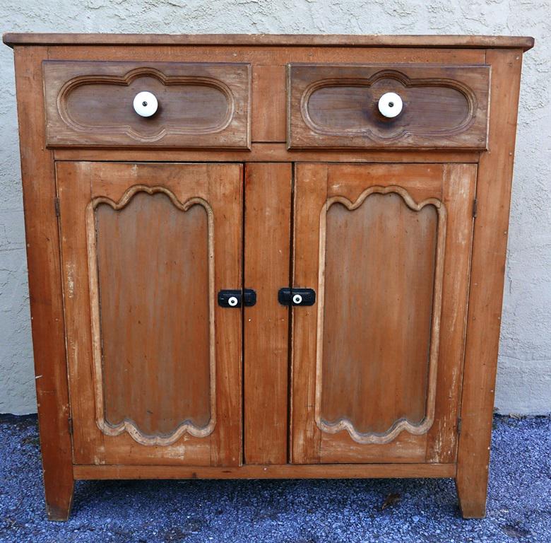 1800's Pa. Jelly Cupboard: Antique late 1800's Pennsylvania tulip poplar jelly cupboard with stripped finish, two top drawers with ceramic pulls, two doors with original iron locks and hinges, 42.25"W, 17"D, 42.5"H