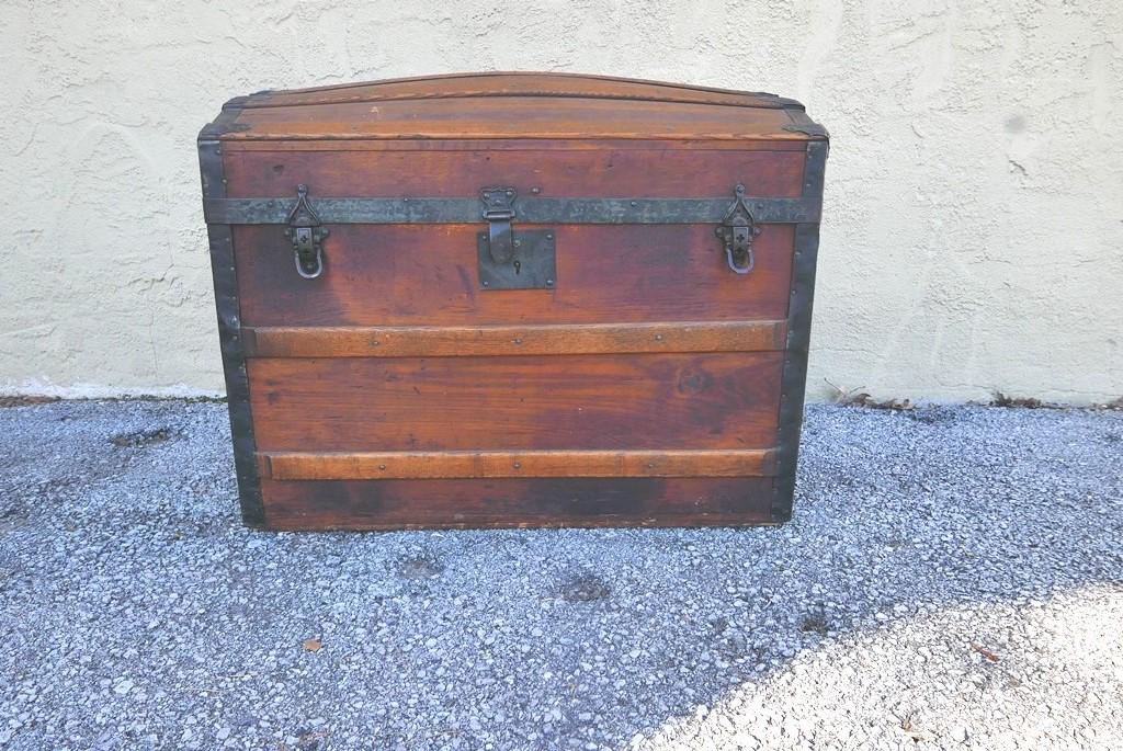 Small Dome Top Steamer Trunk: Small late 1800's dome top steamer trunk, pine with oak strips and tin banding, original leather straps on sides, interior lid has original paper covering with lithograph, 28"W, 17.5"D, 23"H