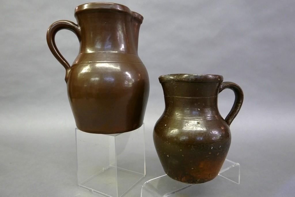 Cowden & Wilcox Harrisburg Pitcher & Other: Brown glazed pitcher with incised lines at shoulder and applied loop handle stamped "Cowden & Wilcox Harrisburg" 8.75"H with .25" chip on spout, similar small unsigned pitcher with incised line decora