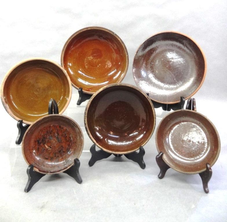 Six Antique Redware Bowls: Redware bowl with scattered small touches of manganese with a hairline crack on shoulder 6"D, small bowl with lots of manganese decoration worn with rim chips 5.75"D, early bowl 9.25"D, three molded b