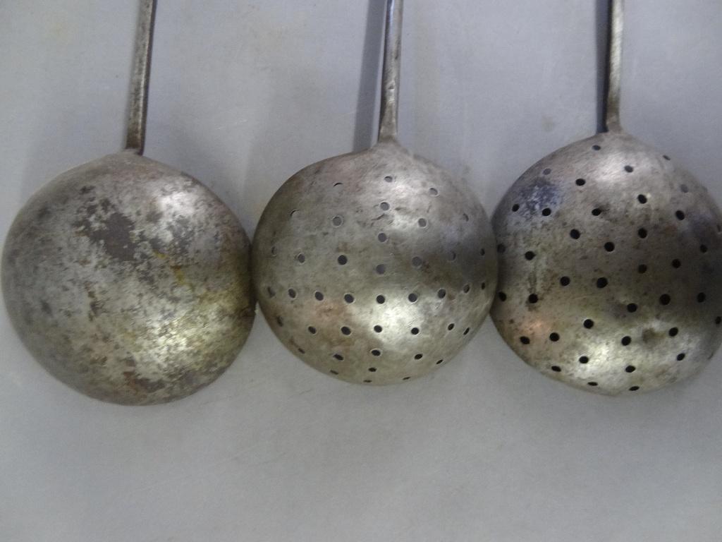 Wrought Iron Cooking Utensils & Copper Accessories: Antique 1800's wrought iron utensils with rat tail handles, two strainers and one ladle 18" to 20"L, copper measure or mug with attached plaque engraved "JAMES LEFEVRE" 4"h, copper mold with ear of co
