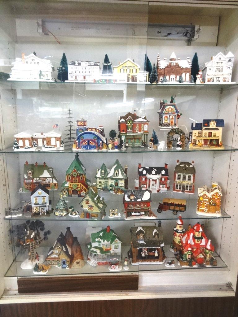 Christmas Porcelain Houses: Collection of Norman Rockwell and Dept. 56 House and Accessories, some Barrel Trees, Dept. 56 Music Box, 24 Houses Ceramic including a truck signed and stamped, recommend pick up