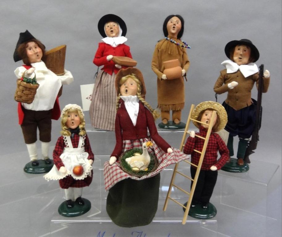 Byers Choice Carolers: Seven Byers Choice: Williamsburg Log Hauler, Golden Goose, Plymouth Plantation Pilgrim, Plymouth Plantation Man with Musket, Indian Potter, Two Paper Store Children