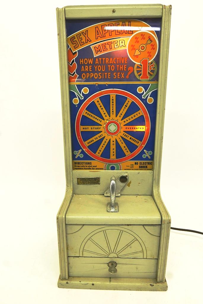 Penny Sex Appeal Meter Arcade Game: Vintage penny arcade game, circa 1941 by the Exhibit Supply Co. Chicago, original glass, repainted oak case with key, 28"H, 11.5"W, 10"D, electrified movement is currently working but not guaranteed