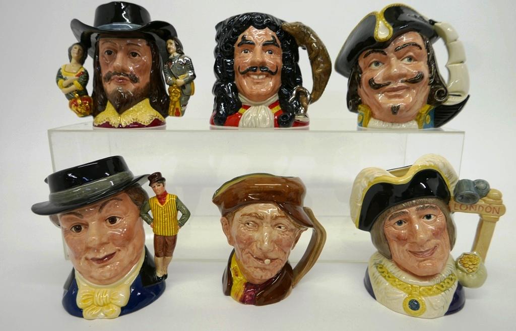 Six Large Royal Doulton Toby Jugs: Six Royal Doulton Toby jugs ranging from 6.5" to 7.5"H, Appy, Mr. Pickwick D6959, Dick Whittington D6846, King Charles I D6917, Captain Henry Morgan D6467, Captain Hook D6947
