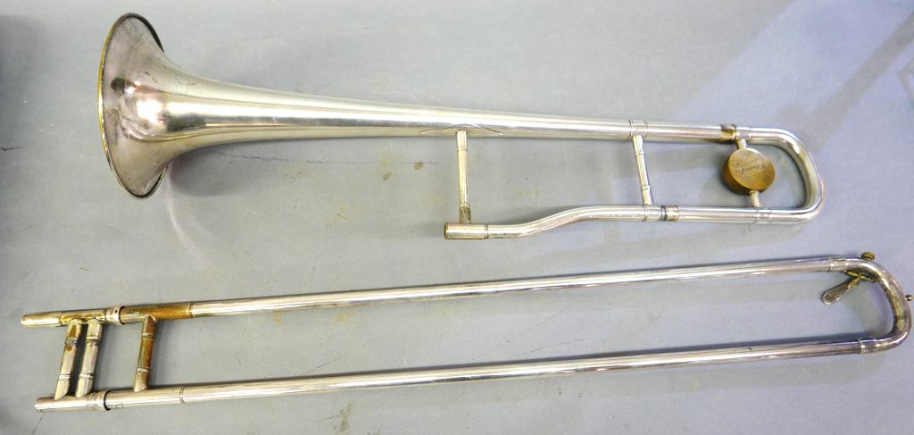 Vintage J.W. York & Sons Trombone & Case: J.W. York & Sons vintage "Professional" trombone, plated and engraved body, includes original painted canvas over wood hard case 35.5"L