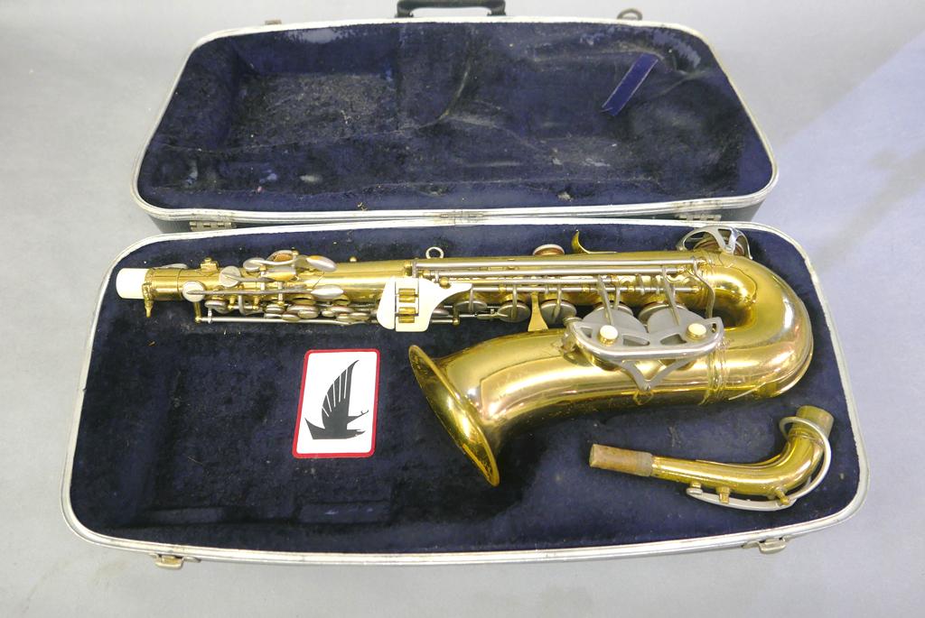 Vintage Saxophone In Case: Vintage unsigned Brass and nickel plate saxophone serial number E45862, comes with a Conn hard case