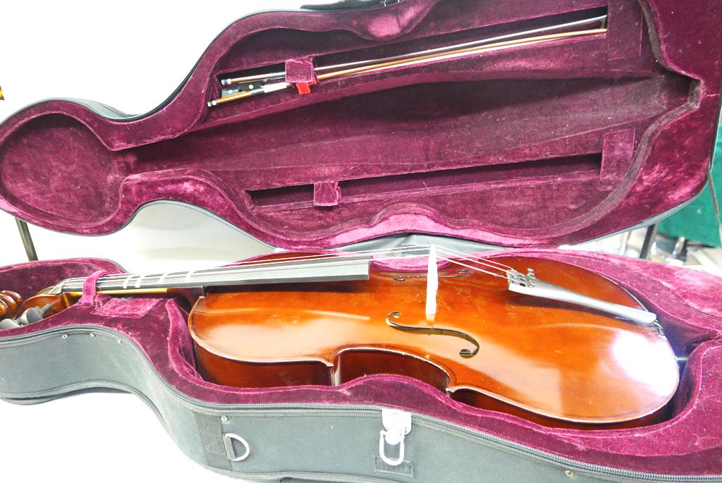 Student Grade Cello & Case: Student grade cello unsigned, includes bow with strings and bow without strings, Intellitouch PT-2 electronic tuner, nice quality padded case with wheels 55"L
