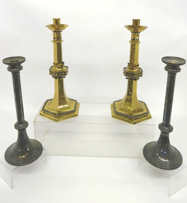Large Pairs of Brass & Silver-Plate Candlesticks: Pair of brass Gothic style candlesticks with twisted steel trim, 19.5"H, pair of silver-plate candlesticks 18"H