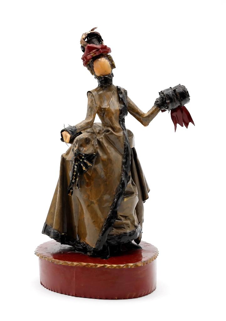 Lee Menichetti Victorian Artisan Costume Sculpture: Lee Menichetti [New York & Palm Beach Florida - 1931 to 1997] well known mid-century artist known for his theatre related art, this sculpture is made of hand bent and painted sheet brass, girl in a bu