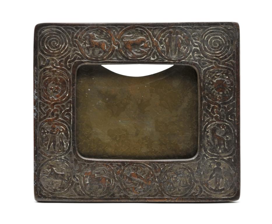 Tiffany Studios "Zodiac" Desk Calendar Frame: Tiffany studios antique Zodiac pattern easel back calendar frame, patinated bronze, impressed on back "Tiffany Studios New York 943", 7" by 8"