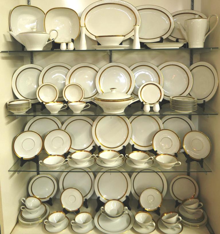 Antique Haviland Porcelain 94 Piece Set: Antique Johann Haviland of Bavaria porcelain dinner, luncheon and tea set, white with gold trim, includes teapot 11"L, coffee pot 7.5"H, 11 teacups with 12 saucers, 7 bouillon cups with 8 saucers, 10