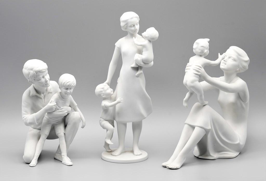Three Kaiser Mother & Father With Children Porcelain: Kaiser of West Germany bisque porcelain mother with two boys mold #438, 10"H, Kaiser bisque porcelain mother with boy mold #398, 8"L, 9"H, Kaiser bisque porcelain father with son mold #659 limited edi