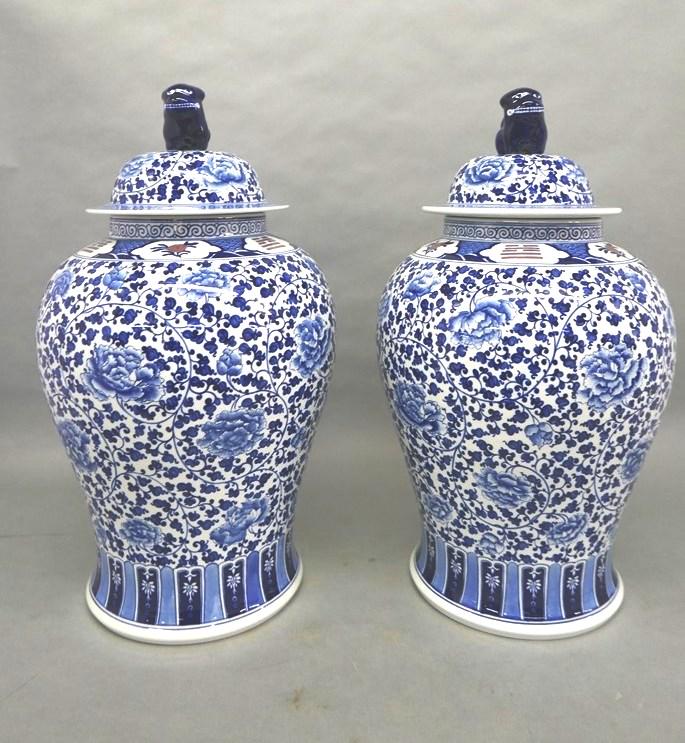 Pair of Large Tai Hwa Covered Urns: Purchased by the consignor from Tai Hwa Pottery Co. Ltd. Taipei Taiwan, Pair of large hand painted covered urns or floor vases, blue and white floral and geometric decoration with scattered rose color