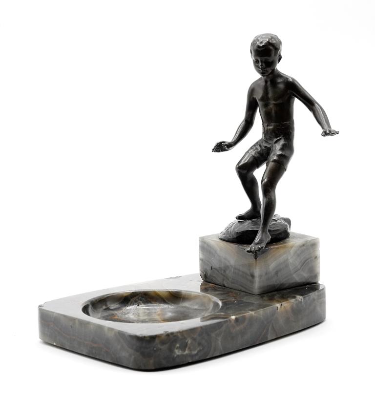 Ruff Bronze Statue On Ashtray: Small bronze statue of a boy dipping his toe signed Ruff on base, attributed to Andor Ruff [Hungary & Austria - 1885 - 1951], mounted onto an onyx ashtray, statue 5.5"H, ashtray 7"L