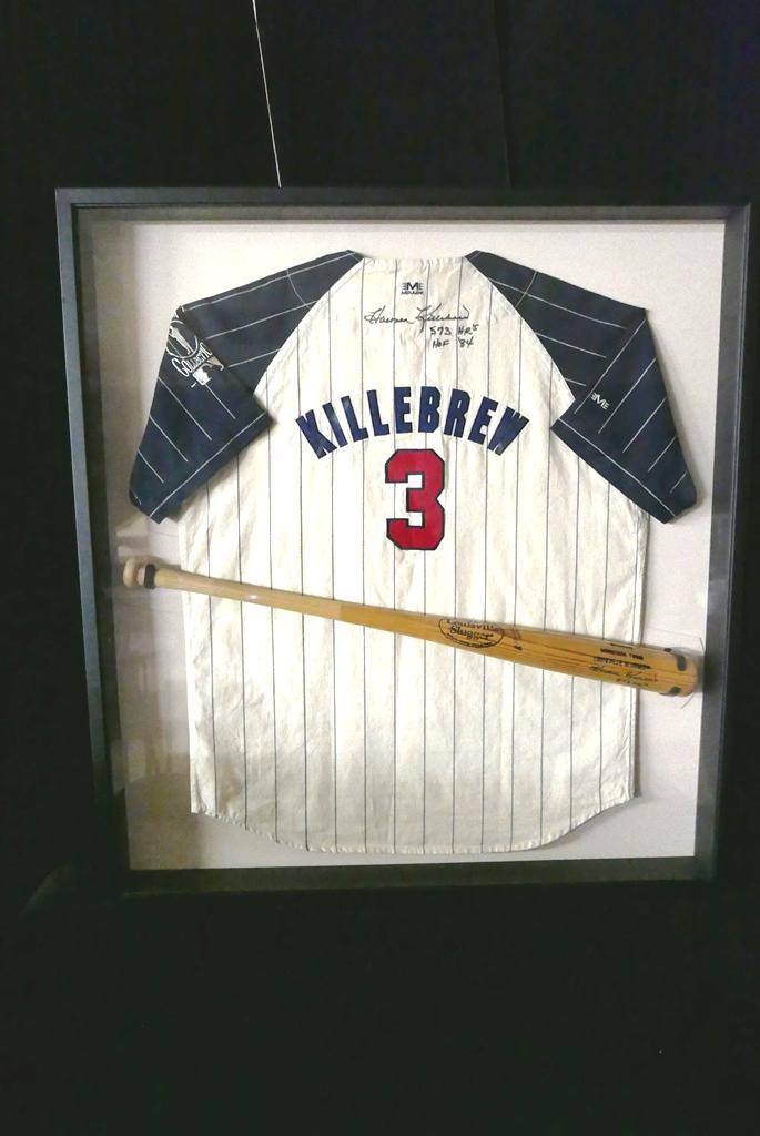 Harmon Killebrew Signed Jersey & Bat Framed: Harmon Killebrew Mirage jersey hand signed "Harmon Killebrew 573 HR's HOF '84", Genuine Minnesota Twins Louisville Slugger bat hand signed by Killebrew, both are professionally mounted in a quality wo