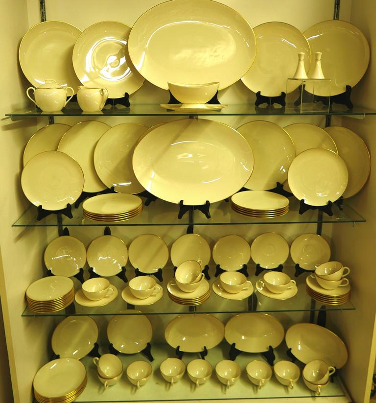 Lenox Olympia 88 Piece Dinner Service: Lenox Olympia pattern dinner service, cream with gold trim, includes 12 dinner plates, 12 luncheon plates, 8 bowls, 12 bread plates, 2 large trays, 3 vegetable bowls, 18 teacups and 18 saucers, sugar 