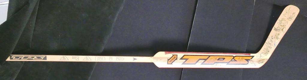 Autographed Flyers Hockey Stick, 16 Signatures: Louisville TPS Cechmanek wood goalie stick wrapped in Kevlar, serial number 5871A with about 16 signatures