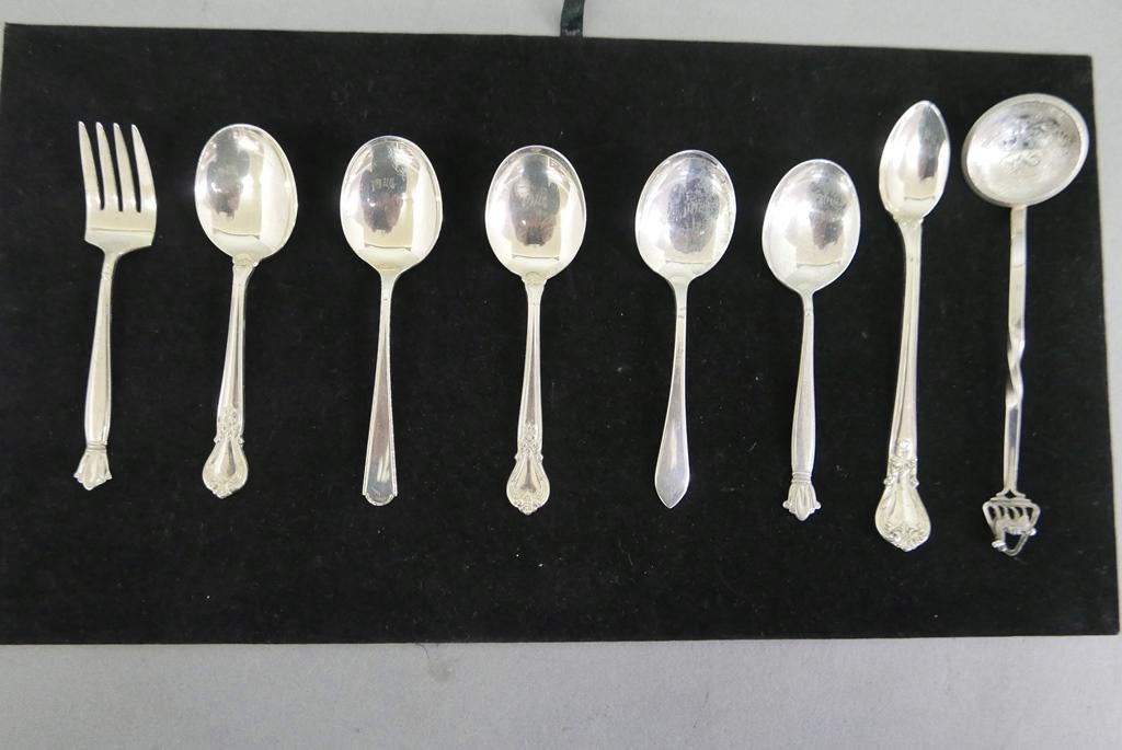 Small Silver Table Items: Group of small sterling spoons and a fork, also a spoon made from a Peruvian silver coin, total weight 4.82 ounces troy