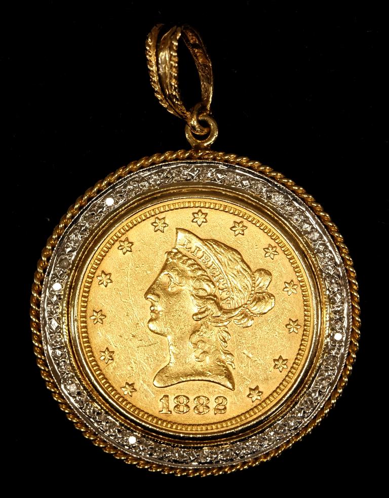 1882 Liberty Head Gold Eagle in Gold & Diamond Pendant: 1882 United States ten dollar Liberty Head gold coin in circulated condition mounted in a 14K white and yellow gold pendant with diamonds chips total weight 25.7 grams